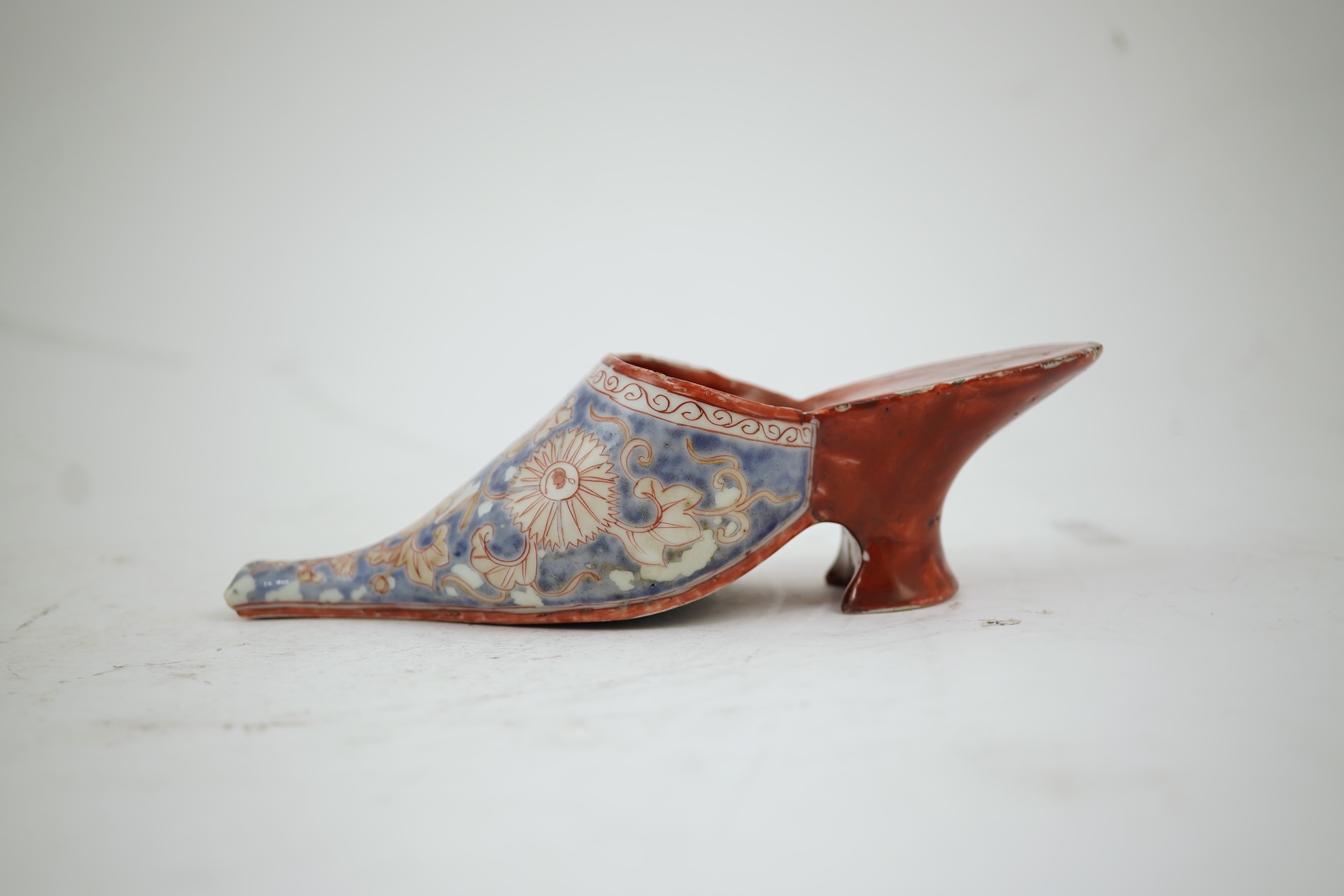 A rare Japanese Arita or Chinese porcelain model of a shoe, based on a Delft shape, first half of 18th century